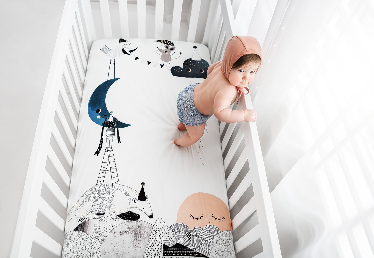 Peekaboo Moon, Pink Pajamas, Moon & Stars Swaddle, and Moon Crib Sheet