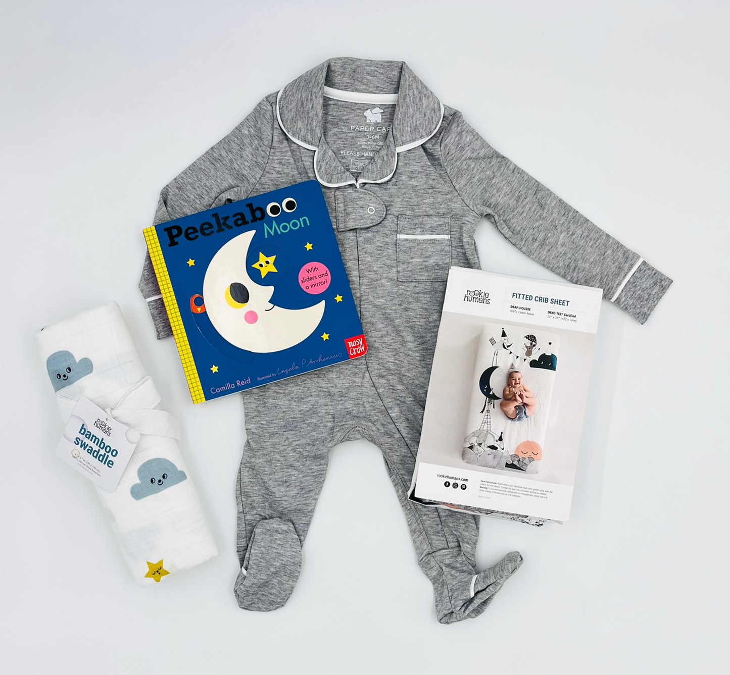 Peekaboo Moon, Grey Pajamas, Moon & Stars Swaddle, and Moon Crib Sheet